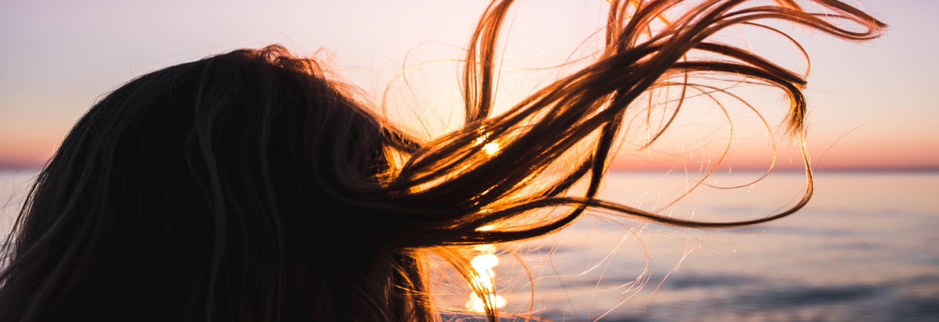 Picture of blonde hair during sunset
