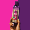 An image of Aussie 1 InHand Kiss of live shampoo bottle on the pinky-purple background